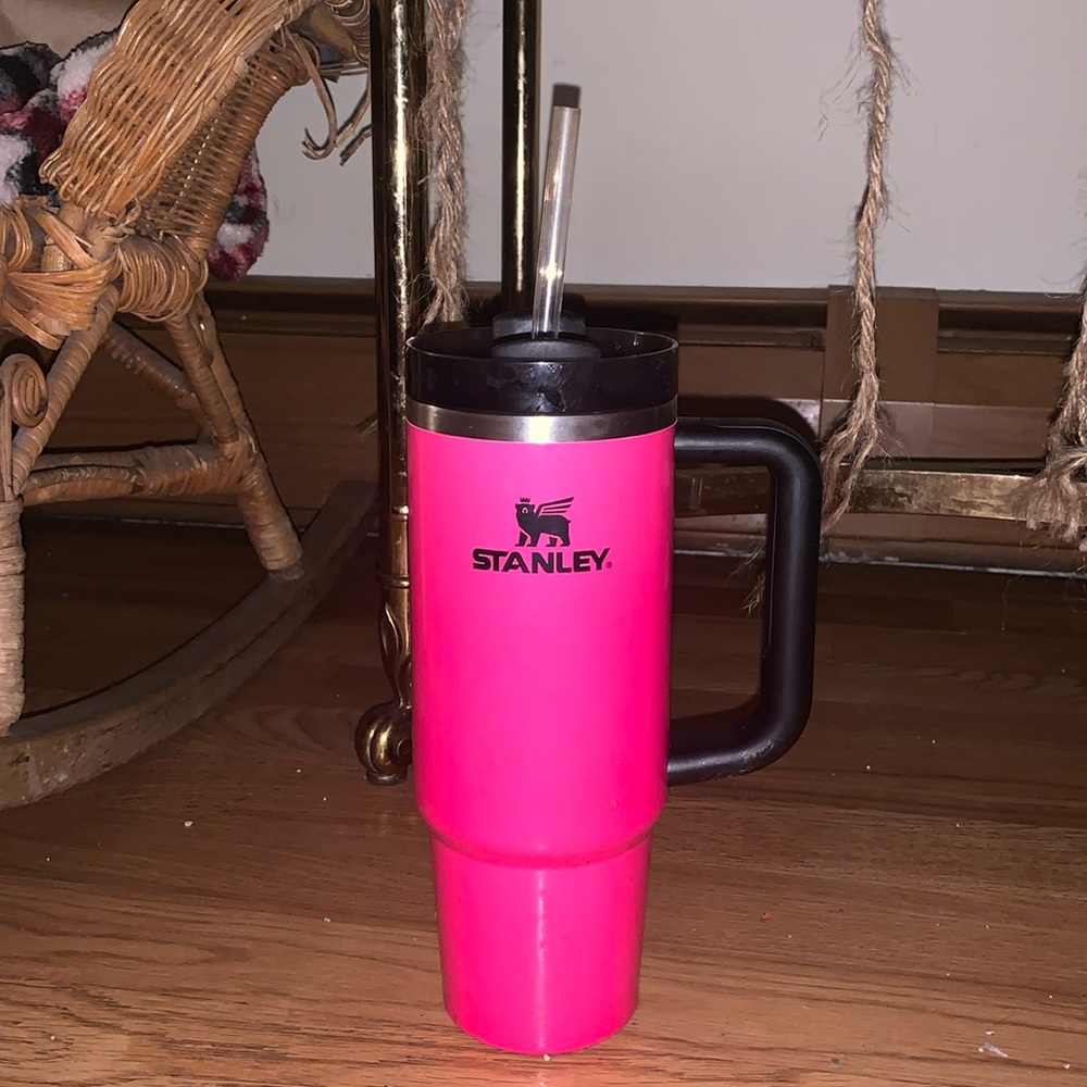 A pink black Stanley cup 40oz